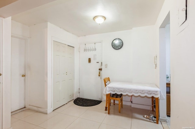 entryway with light tile patterned floors