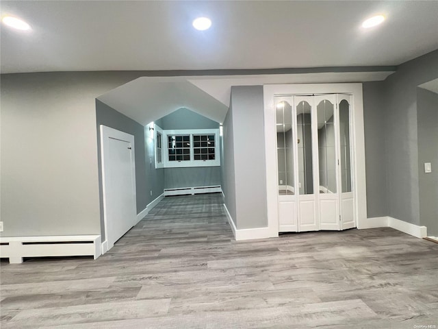 interior space featuring light hardwood / wood-style floors and a baseboard heating unit