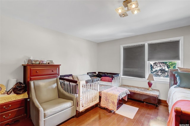 bedroom with hardwood / wood-style floors