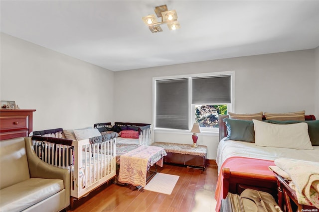 bedroom with wood-type flooring