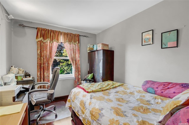 bedroom featuring hardwood / wood-style floors