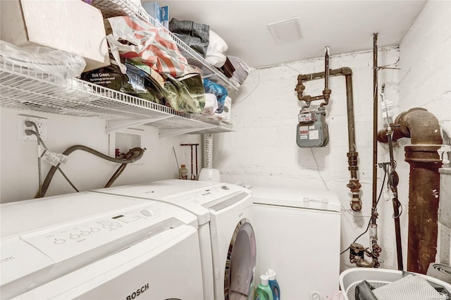 laundry room with washer and clothes dryer