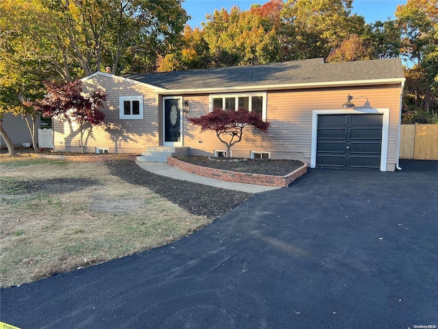 single story home featuring a garage