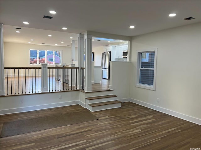 stairway with hardwood / wood-style floors