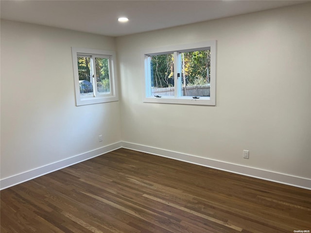 spare room featuring dark hardwood / wood-style floors