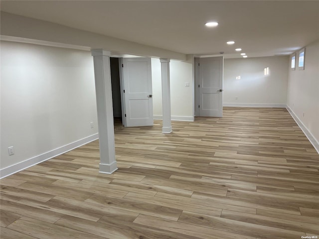 basement featuring light hardwood / wood-style floors