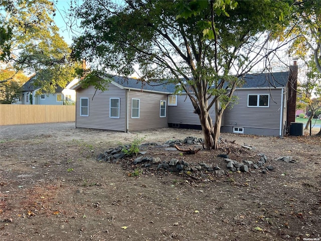 rear view of property with central AC unit