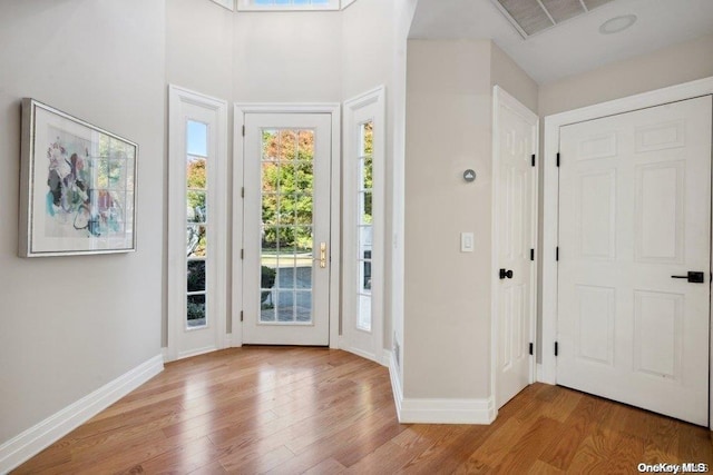 foyer with light hardwood / wood-style flooring