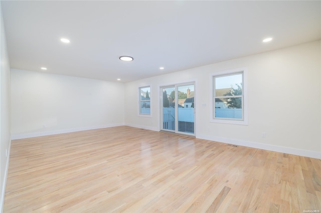 unfurnished room with light hardwood / wood-style flooring