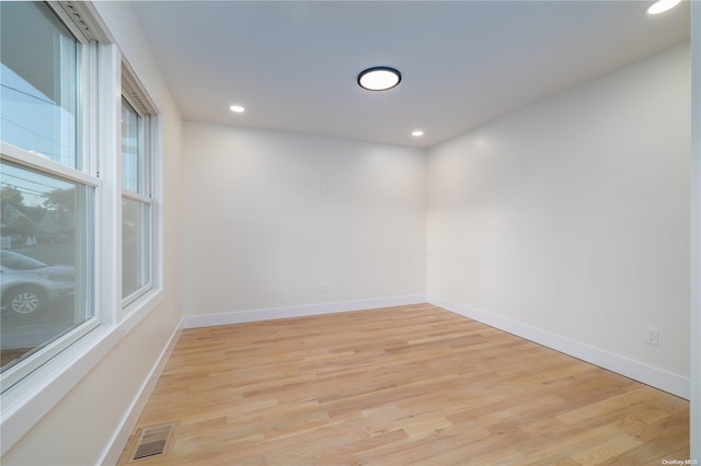 unfurnished room featuring light hardwood / wood-style flooring