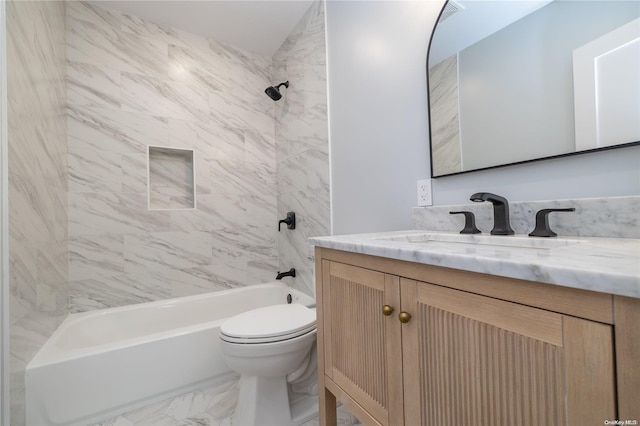 full bathroom featuring vanity, toilet, and tiled shower / bath