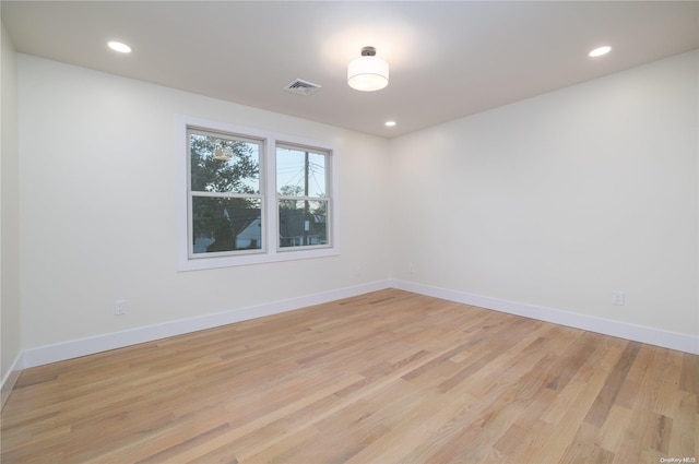 empty room with light hardwood / wood-style floors