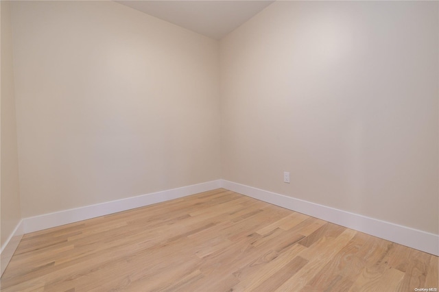 spare room featuring light hardwood / wood-style flooring