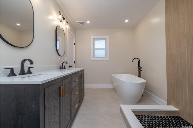 bathroom featuring vanity and a bathtub