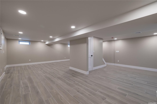 basement featuring light hardwood / wood-style floors