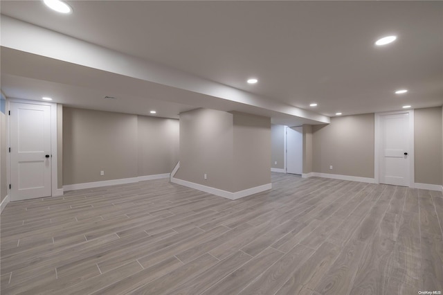 basement featuring light wood-type flooring