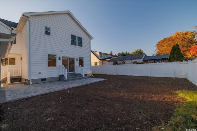 rear view of property featuring a patio