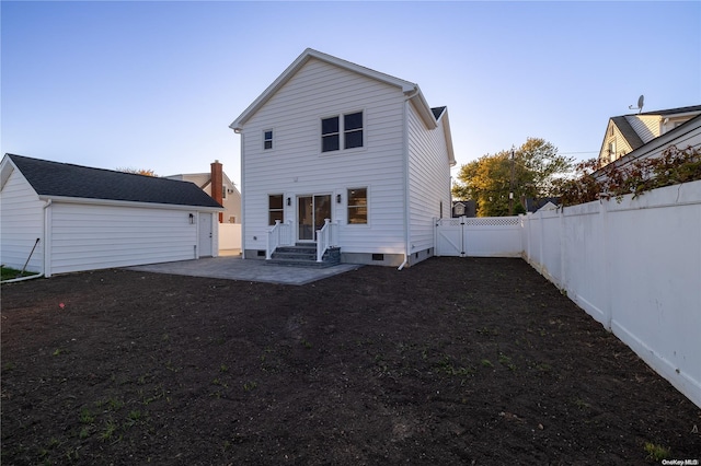 rear view of house featuring a patio area and an outdoor structure