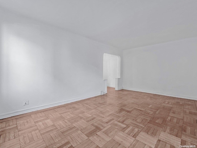 unfurnished room with light parquet floors