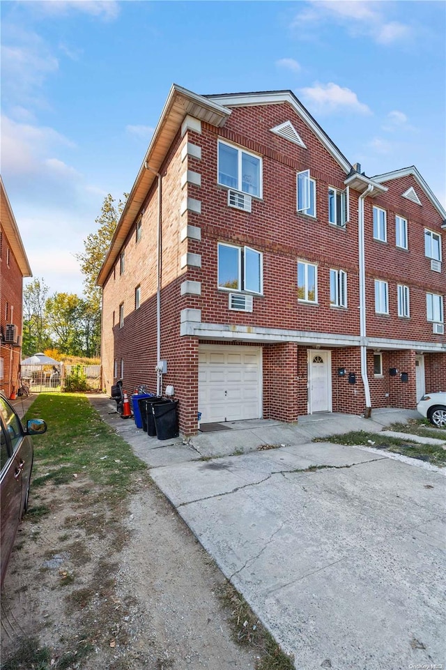 view of side of home featuring a garage