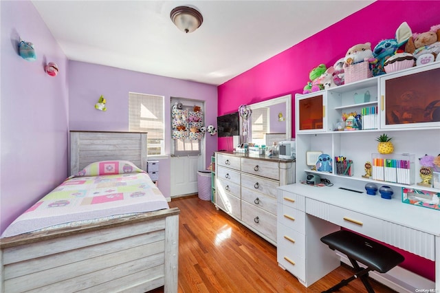 bedroom with light hardwood / wood-style floors