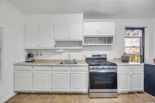 kitchen with white cabinetry, stainless steel range with gas cooktop, and sink