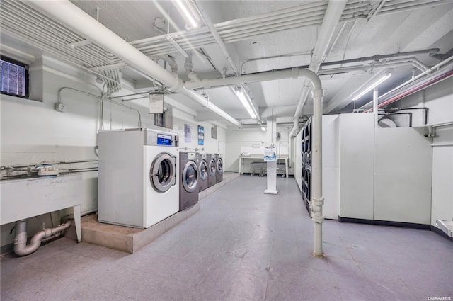 clothes washing area featuring washer and dryer