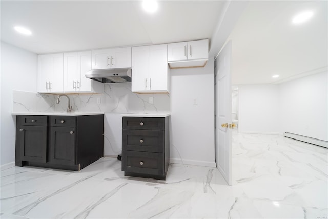 kitchen featuring white cabinetry, sink, tasteful backsplash, and a baseboard radiator