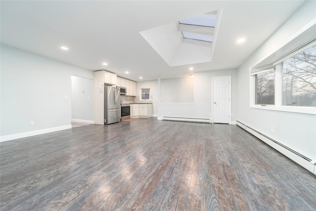 unfurnished living room featuring dark wood-type flooring and a baseboard radiator