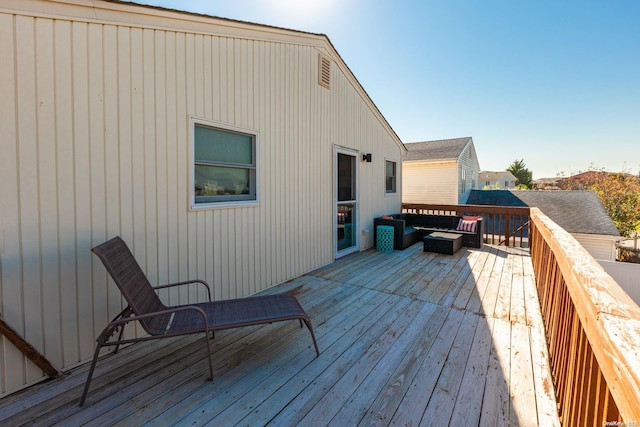 wooden deck with outdoor lounge area