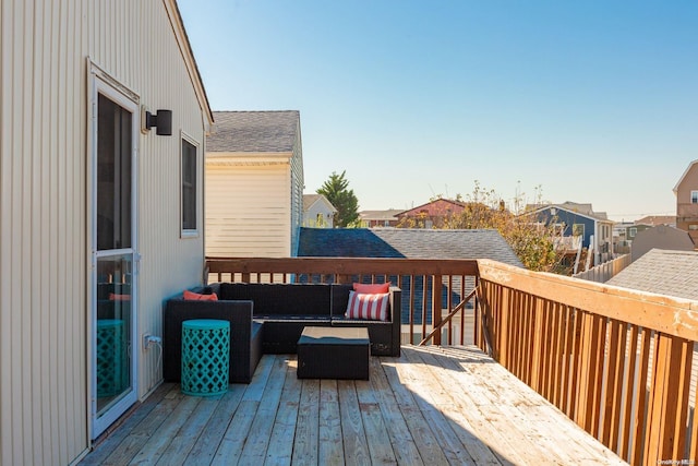 wooden deck featuring an outdoor hangout area