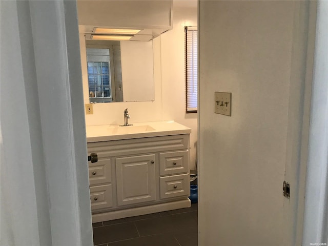 bathroom with tile patterned flooring and vanity