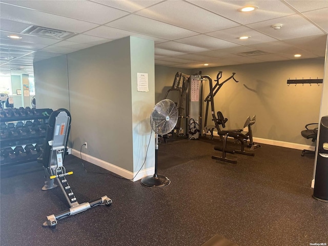 exercise room featuring a paneled ceiling