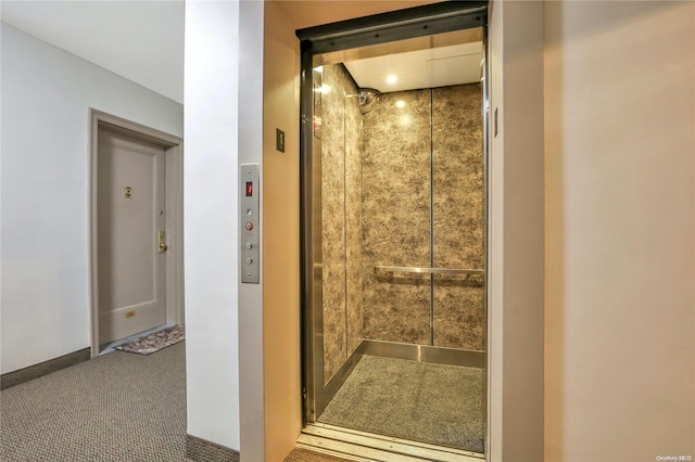 bathroom with tile patterned floors and elevator