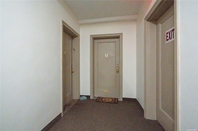 hallway with dark carpet