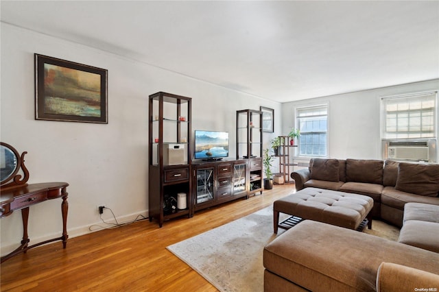 living room with hardwood / wood-style floors and cooling unit