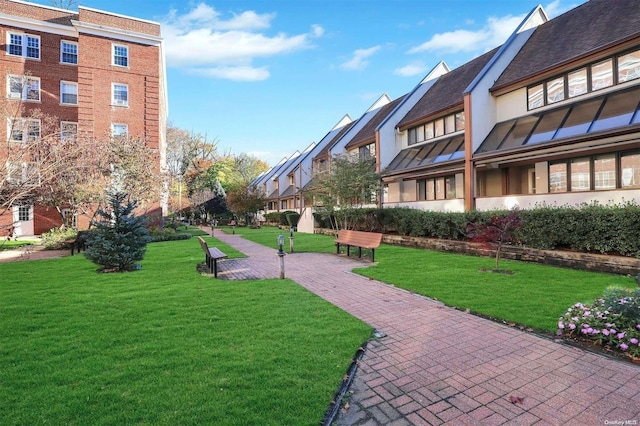 view of community featuring a yard