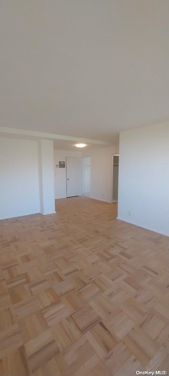 spare room featuring light parquet floors