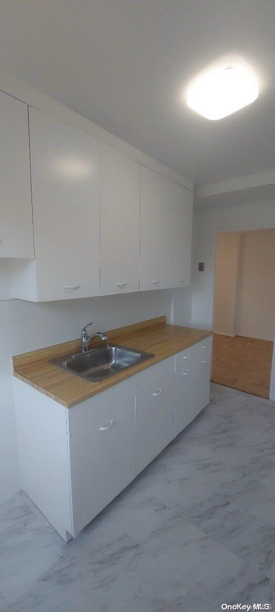 kitchen with white cabinets and sink