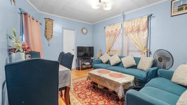 living room featuring hardwood / wood-style floors and crown molding