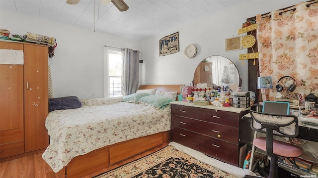 bedroom featuring ceiling fan and light hardwood / wood-style floors