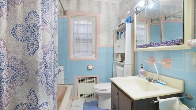 bathroom with vanity, tile patterned flooring, toilet, tile walls, and radiator heating unit