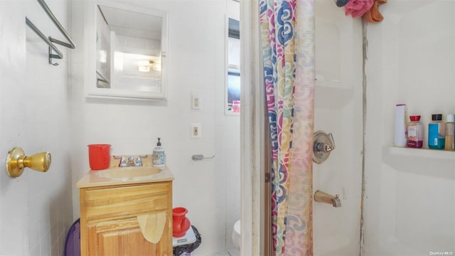 bathroom with a shower with curtain, toilet, and tile walls