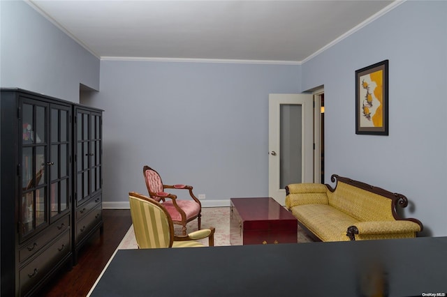 living room with dark hardwood / wood-style flooring and ornamental molding