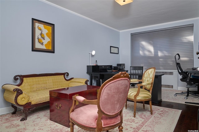 office area with hardwood / wood-style floors and ornamental molding