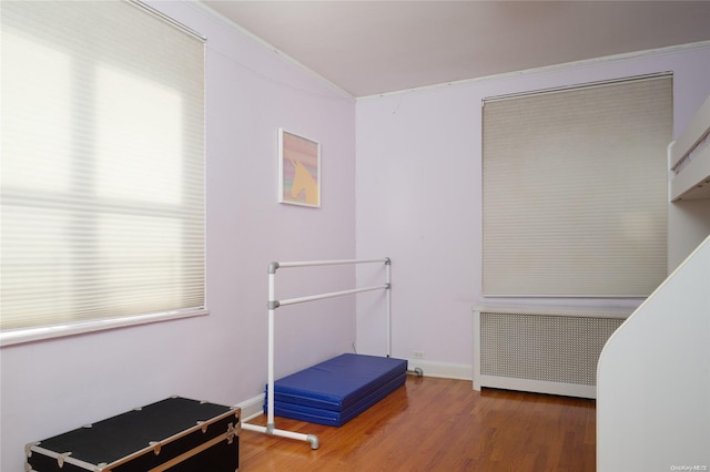 misc room with hardwood / wood-style floors and radiator