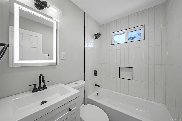 full bathroom with vanity, toilet, and tiled shower / bath