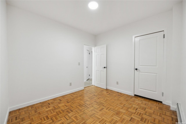 unfurnished bedroom with light parquet floors