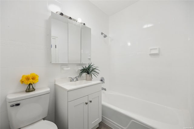 full bathroom featuring toilet, vanity, and shower / bathtub combination