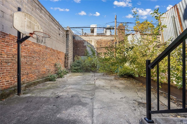 view of patio with basketball hoop